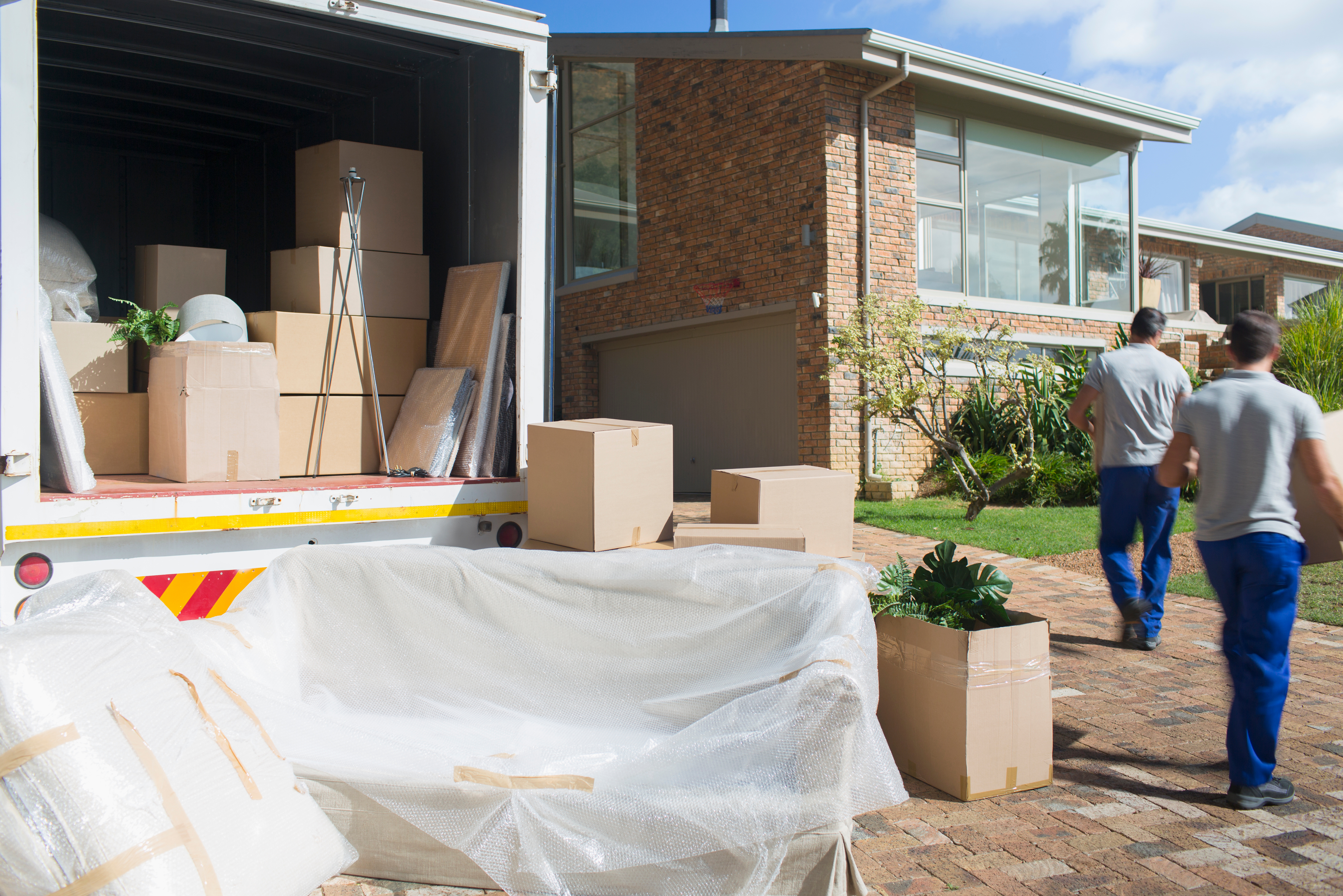 Hire movers transporting household items professionally